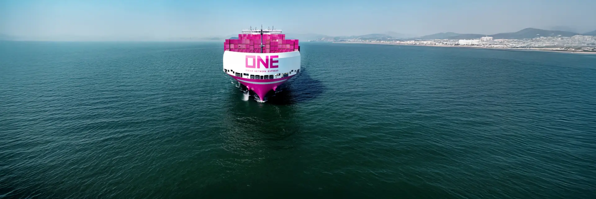 ONE container ship sailing toward the horizon